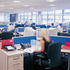 Simple, repetitive desking. Long vistas are punctuated with glass box meeting rooms