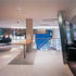 The reception area,  with stairs down to the double-height hub