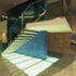 The feature stairs consist of precast white concrete treads,  cantilevering from a reinforced concrete spine wall