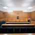 One of the lower level, more formal courts with daylight ducted from south wall entering to the left.  Note the architect-designed light fittings