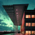 The cantilevered roof profile protects the building from sunlight glares