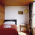 The two smaller bedrooms have low timber ceilings, which allows for loft storage in the volume above