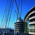The west entrance showing one of the spiral circulation ramps. These are topped by masts which are anchored by cables with dogbone dampers and backstays 