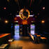 Bars are oak; upholstery and drinks counters are in durable black leather