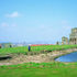 View of Whitby Abbey headland showing Abbey House to the left with Stanton Williams’ visitor centre tucked into the adjacent banqueting hall