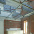 Exposed metal service grids on the ceilings throughout the classrooms