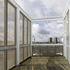 View towards BFLS Strata building. Materials used include larch deck, ETFE roof, mesh screens and 152x152mm columns and beam sections
