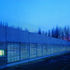 Green oak hydraulic shutters are a necessary security measure, and give the building an entirely different character at night