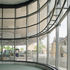 The concourse building is partly enclosed with a curved glass screen