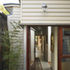 The single storey element hugs the garden wall