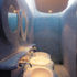 The blue mosaic-clad WC’s are referred to as the ‘swimming pool’