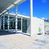 The double-height entrance canopy reinforces the heroic civic scale 