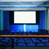 A shutter below the cinema screen opens to reveal the outside world