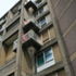 The corner of a block with L-shaped balconies jutting out