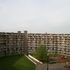 Enclosed recreation area and view of ten-storey block