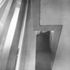 Detail of column and balcony edge at point of non-engagement; the smallness of the clearence is seen, as well as the manner of cladding the structural column in its gold-anodised sheath