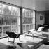 The large living room which, with the dining room separated from it by folding doors, runs the whole length of the main wing of the house