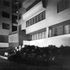 View of the facade and ramp to garages at night