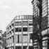 The tall windows of the banking hall reflect the prevailing scale of the street
