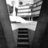 One of the four flights of steps which cut up from the cloister into the court between each pair of structural frames