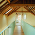 Hall Barn has a first floor bridge which links the staircase to a double bedroom and bathroom over the kitchen