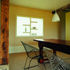 The dining area in Hall Barn – the window opening is set into the thickness of the straw bale wall.