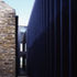 The extension is joined to the exisint structure by a glass link
