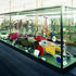 Metal-framed glass cabinets refer to the elegant Aston Webb-designed originals