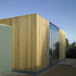 Exterior view, duck-egg blue blockwork and Siberian larch cladding