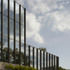 The glazing reflects the sky surrounding