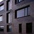 The brick walls are deeply recessed at window openings