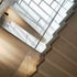 View looking up side of stair to glazed roof above