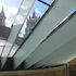 Glass beams spanning over existing parapet