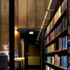Veil of painted perforated brass panels line the reading room