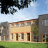 The near elevation is bookended with two extensions clad with cement fibre boards