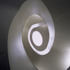 The oval-shaped stairs are constructed using engineered timber