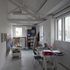 Second-floor studio space with exposed original timber trusses