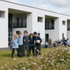 Children play in the landscaped grounds