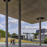 The first-floor deck extends in a deep cantilever over the approach to the student centre