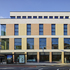 Bricks are hand-set, supported on continuous perimeter shelf-angles at each floor level 