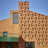The brickwork references the brick pattern of the Old Nun’s Head pub opposite