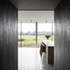 The entrance is clad in blackened oak