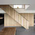 The oak staircase cuts through the living space