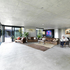 The rugs and furniture offer contrast from the concrete carapace