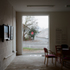 Picture windows connect the interior spaces with the surrounding streets