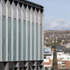 The concrete columns support the perimeter steel columns above
