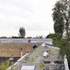 The roof is stepped with triangular-sectioned, stainless-steel trays