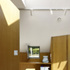 A workroom and office sit beneath the asymmetrical roof pitch