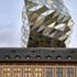 The envelope uses triangular panels to morph angularity into curves and ripples