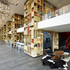 The ground floor is a large lobby, divided into connected living, eating and working areas